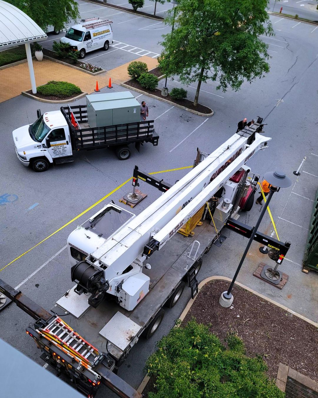 Trucks Delivering HVAC Unit