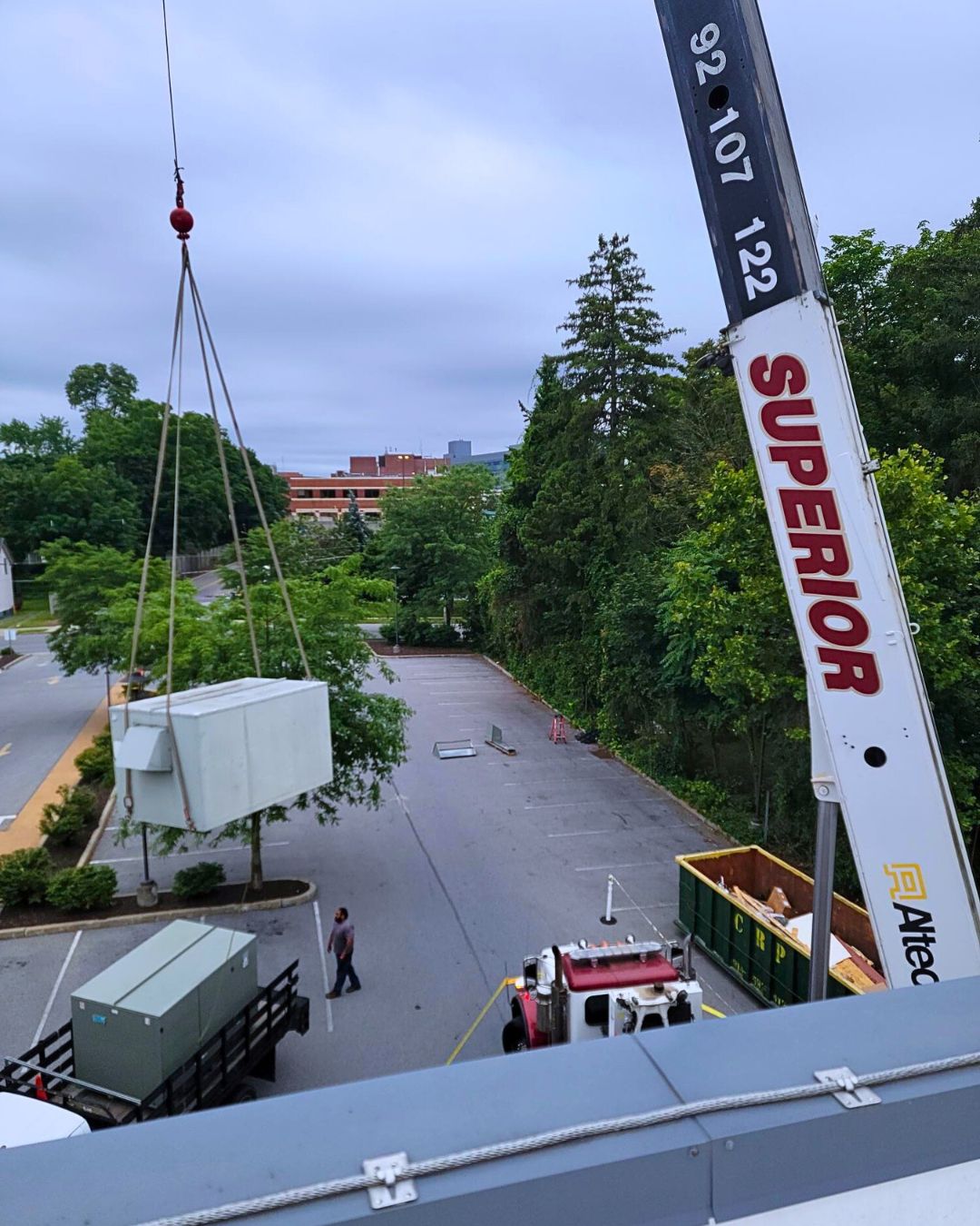 Crane raising HVAC unit